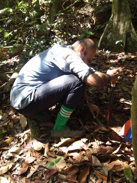 John Mathai collecting soil samples